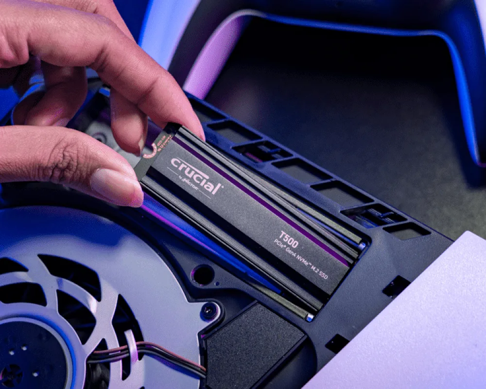 Crucial T500 with heatsink being installed in a PS5